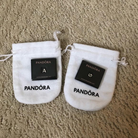 Pandora locket charms new A and G